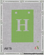 A taped needlepoint canvas with the design: Banner 18 mesh count Squared H White on Light Green.
