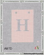 A taped needlepoint canvas with the design: Banner 18 mesh count Squared H White on Pink.