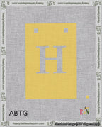 A taped needlepoint canvas with the design: Banner 18 mesh count Squared H White on Yellow.