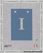 A taped needlepoint canvas with the design: Banner 18 mesh count Squared I White on Blue.