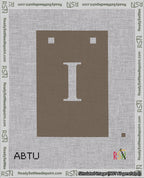A taped needlepoint canvas with the design: Banner 18 mesh count Squared I White on Brown.