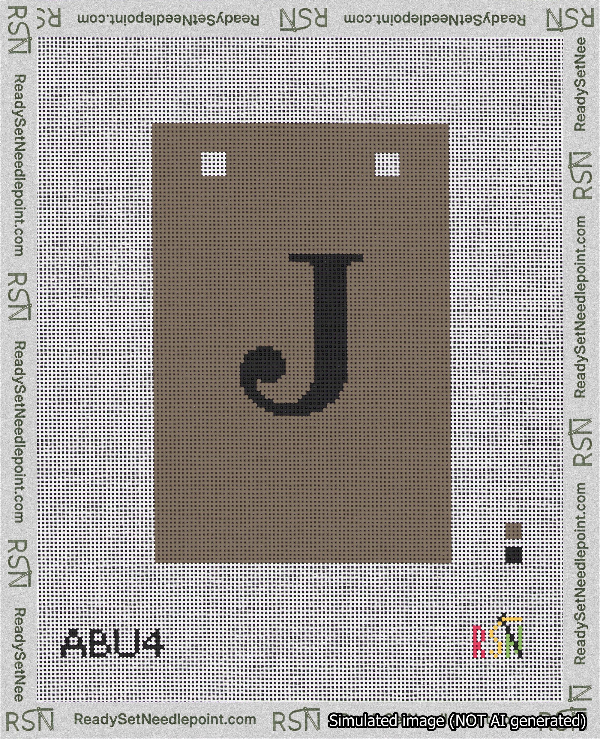 A taped needlepoint canvas with the design: Banner 18 mesh count Squared J Black on Brown.