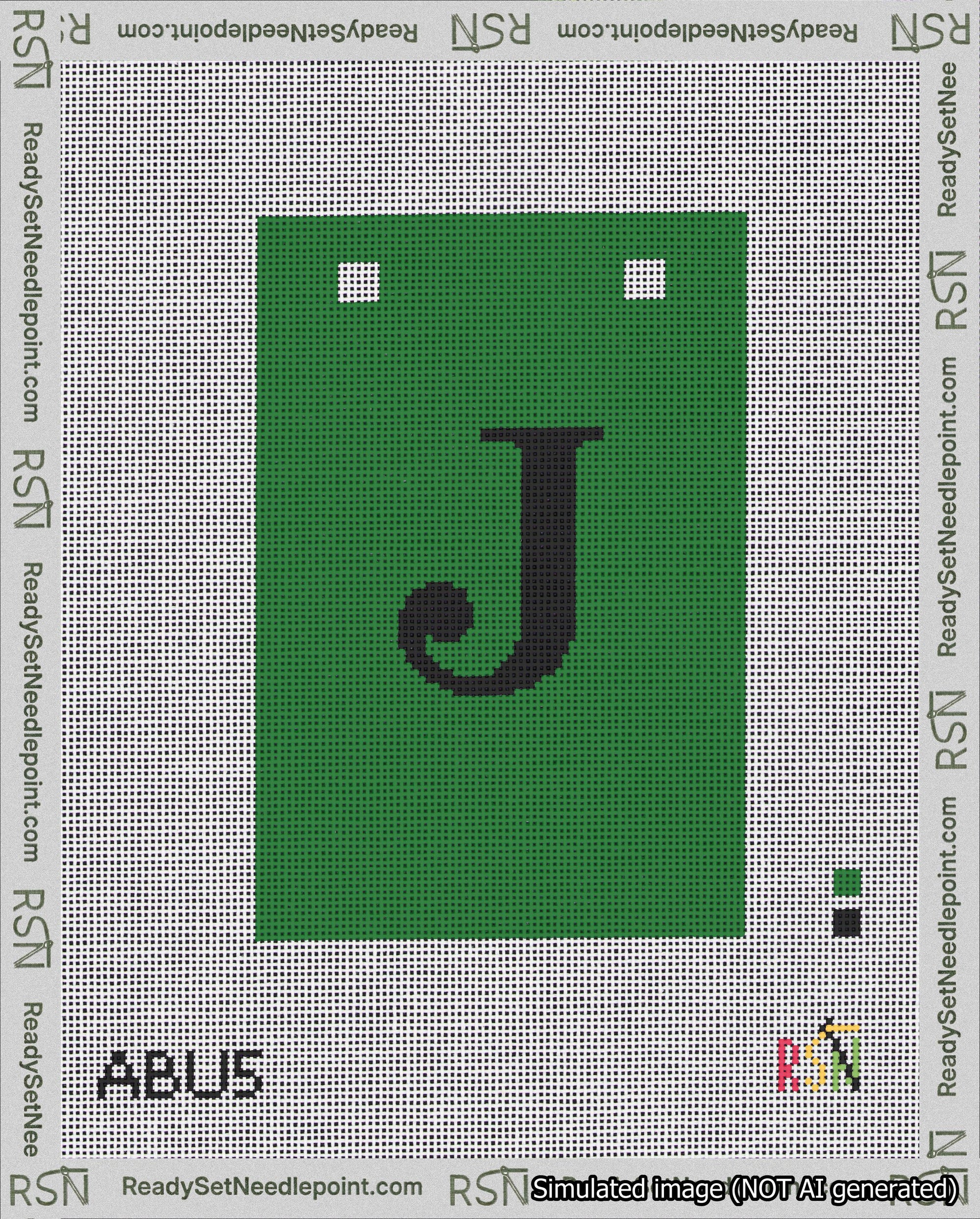 A taped needlepoint canvas with the design: Banner 18 mesh count Squared J Black on Green.