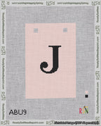 A taped needlepoint canvas with the design: Banner 18 mesh count Squared J Black on Pink.