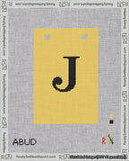 A taped needlepoint canvas with the design: Banner 18 mesh count Squared J Black on Yellow.