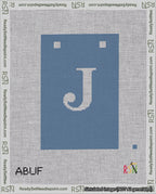 A taped needlepoint canvas with the design: Banner 18 mesh count Squared J White on Blue.