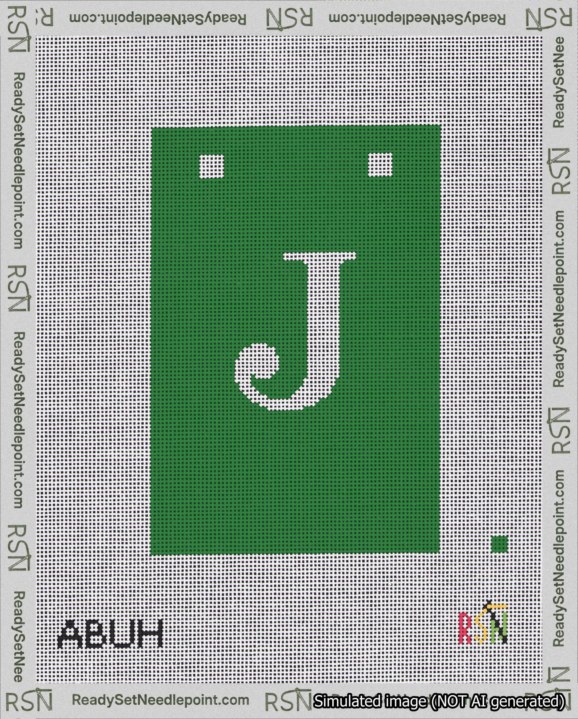 A taped needlepoint canvas with the design: Banner 18 mesh count Squared J White on Green.