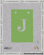 A taped needlepoint canvas with the design: Banner 18 mesh count Squared J White on Light Green.