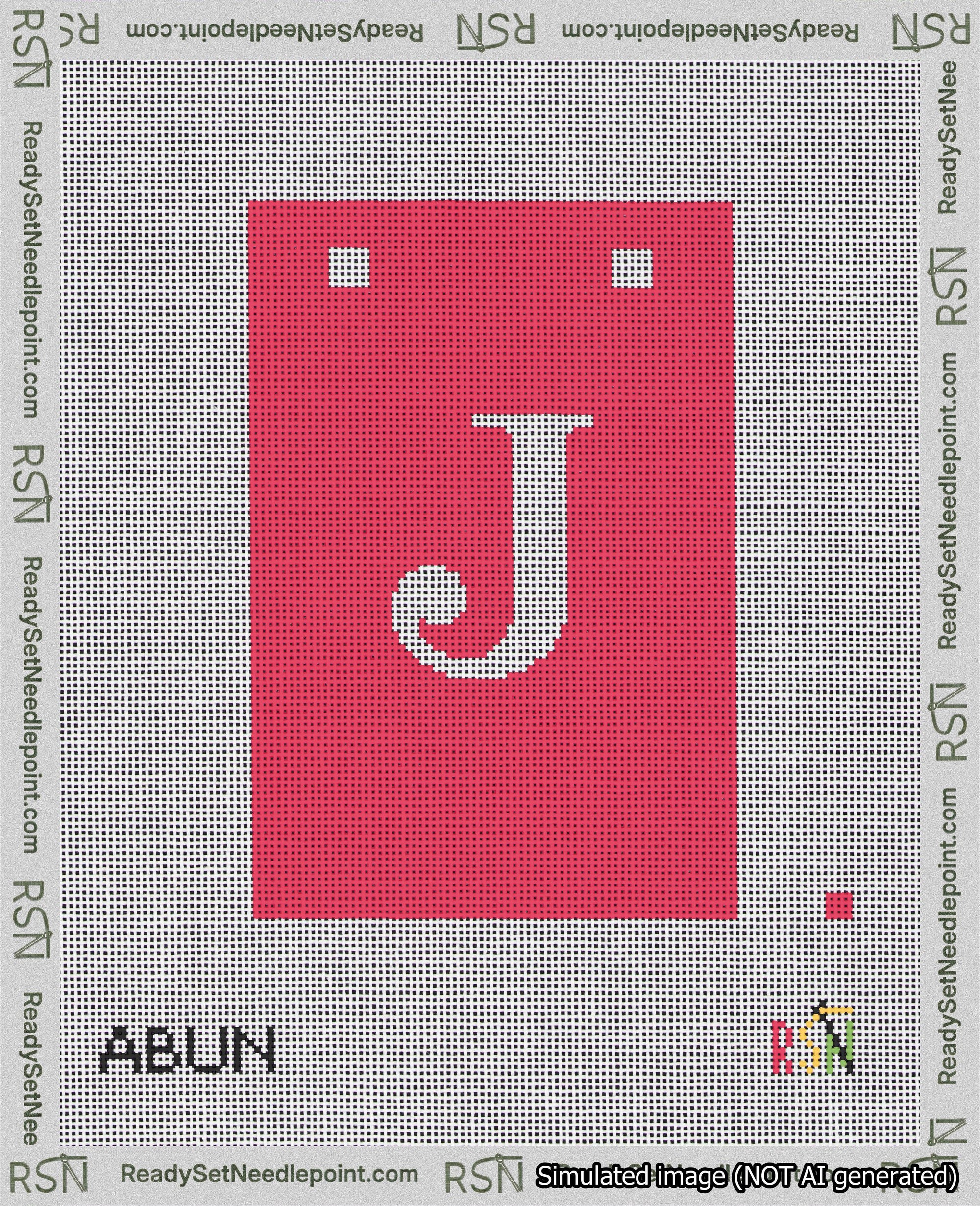 A taped needlepoint canvas with the design: Banner 18 mesh count Squared J White on Red.