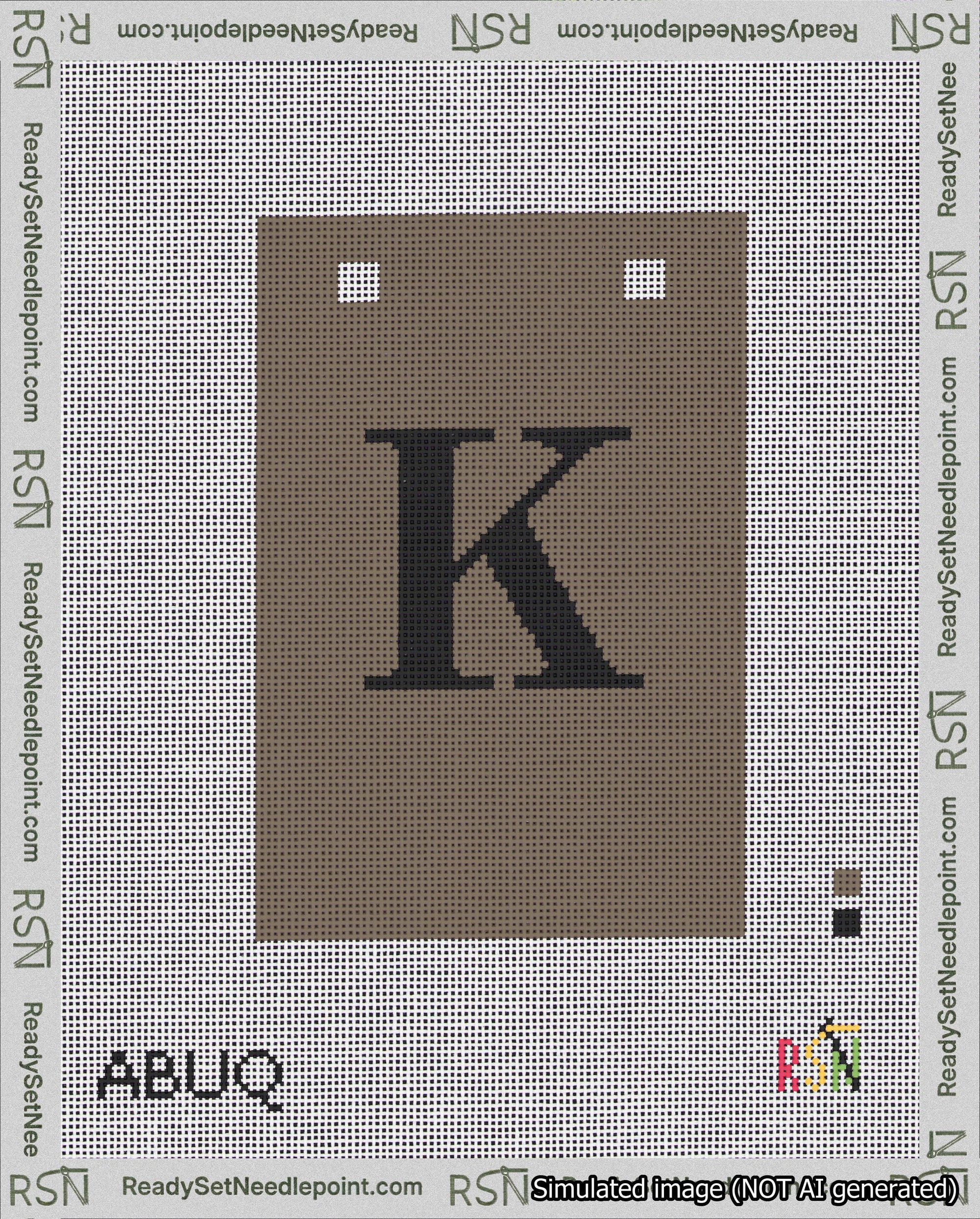 A taped needlepoint canvas with the design: Banner 18 mesh count Squared K Black on Brown.