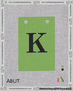 A taped needlepoint canvas with the design: Banner 18 mesh count Squared K Black on Light Green.