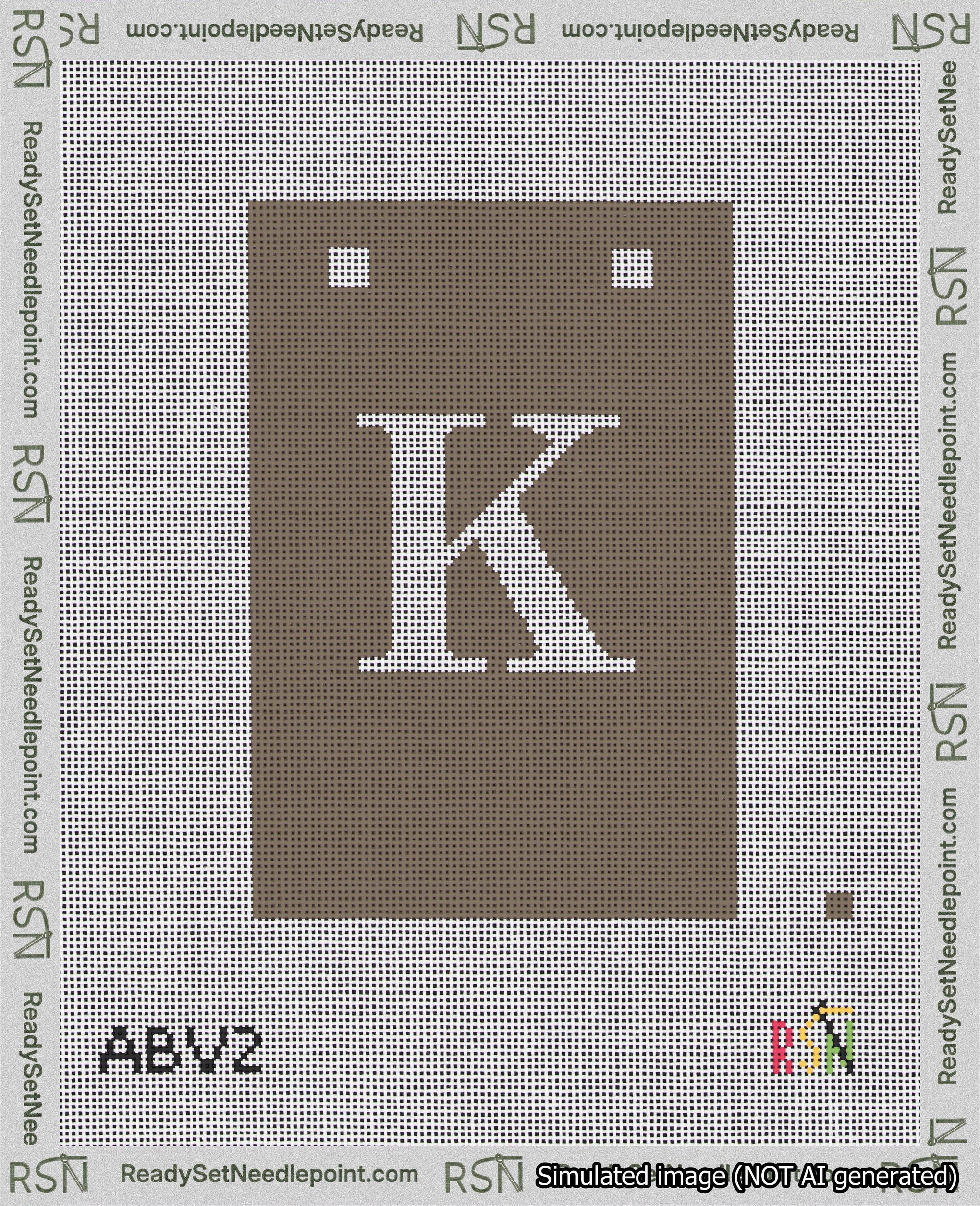 A taped needlepoint canvas with the design: Banner 18 mesh count Squared K White on Brown.