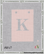 A taped needlepoint canvas with the design: Banner 18 mesh count Squared K White on Pink.
