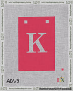 A taped needlepoint canvas with the design: Banner 18 mesh count Squared K White on Red.