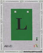 A taped needlepoint canvas with the design: Banner 18 mesh count Squared L Black on Green.