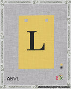 A taped needlepoint canvas with the design: Banner 18 mesh count Squared L Black on Yellow.
