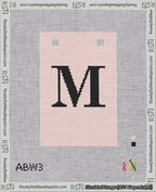 A taped needlepoint canvas with the design: Banner 18 mesh count Squared M Black on Pink.