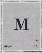 A taped needlepoint canvas with the design: Banner 18 mesh count Squared M Black on White.
