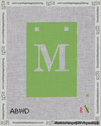 A taped needlepoint canvas with the design: Banner 18 mesh count Squared M White on Light Green.