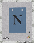 A taped needlepoint canvas with the design: Banner 18 mesh count Squared N Black on Blue.