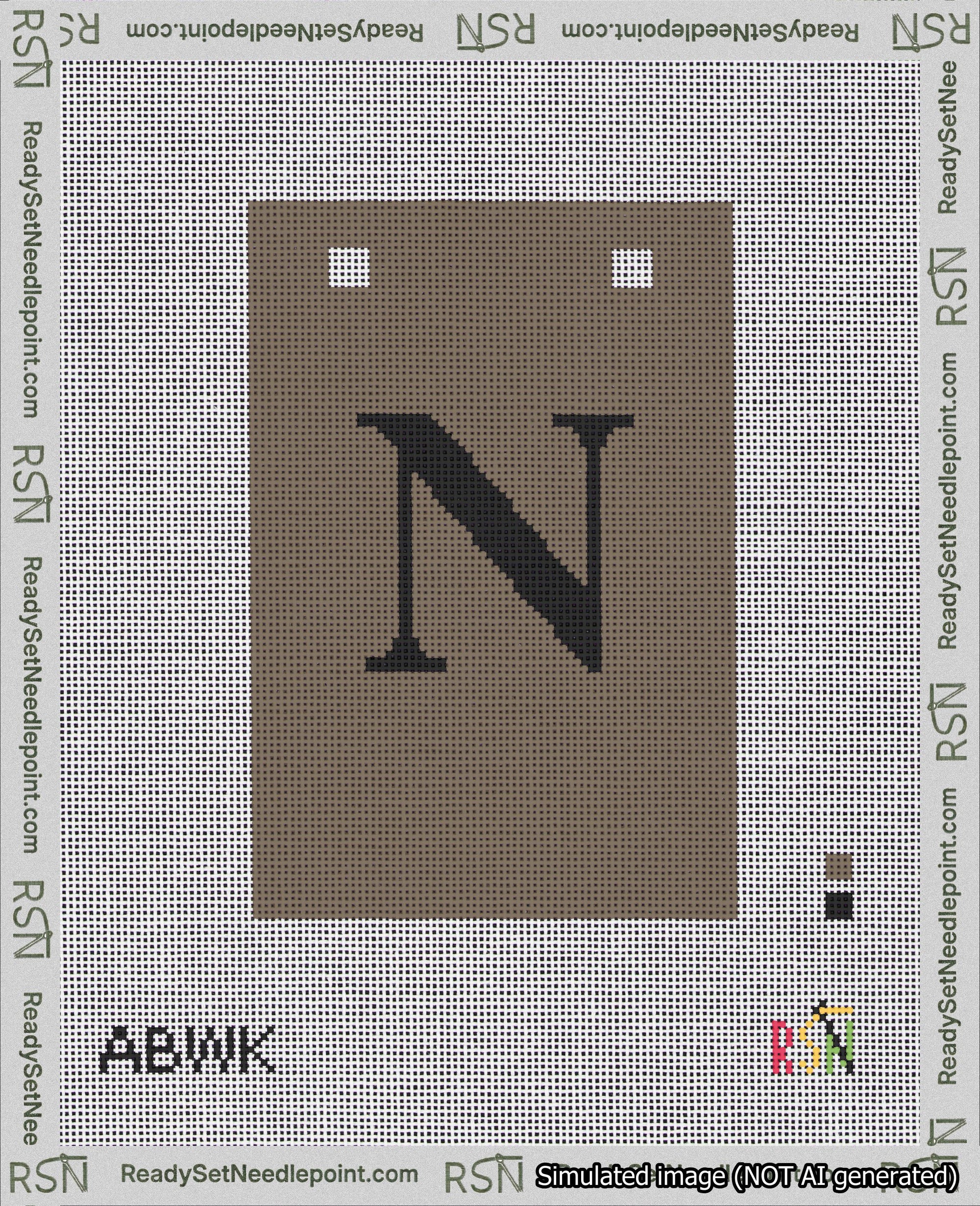 A taped needlepoint canvas with the design: Banner 18 mesh count Squared N Black on Brown.