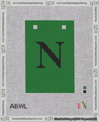 A taped needlepoint canvas with the design: Banner 18 mesh count Squared N Black on Green.