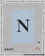 A taped needlepoint canvas with the design: Banner 18 mesh count Squared N Black on Light Blue.