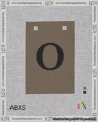 A taped needlepoint canvas with the design: Banner 18 mesh count Squared O Black on Brown.