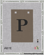 A taped needlepoint canvas with the design: Banner 18 mesh count Squared P Black on Brown.
