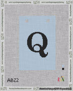 A taped needlepoint canvas with the design: Banner 18 mesh count Squared Q Black on Light Blue.