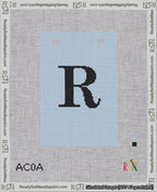 A taped needlepoint canvas with the design: Banner 18 mesh count Squared R Black on Light Blue.