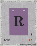 A taped needlepoint canvas with the design: Banner 18 mesh count Squared R Black on Purple.