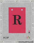A taped needlepoint canvas with the design: Banner 18 mesh count Squared R Black on Red.