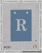 A taped needlepoint canvas with the design: Banner 18 mesh count Squared R White on Blue.