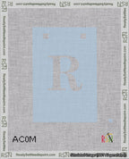 A taped needlepoint canvas with the design: Banner 18 mesh count Squared R White on Light Blue.