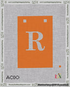 A taped needlepoint canvas with the design: Banner 18 mesh count Squared R White on Orange.