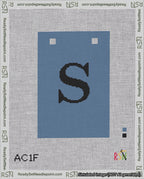 A taped needlepoint canvas with the design: Banner 18 mesh count Squared S Black on Blue.