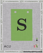 A taped needlepoint canvas with the design: Banner 18 mesh count Squared S Black on Light Green.