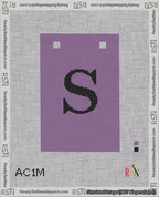 A taped needlepoint canvas with the design: Banner 18 mesh count Squared S Black on Purple.