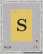 A taped needlepoint canvas with the design: Banner 18 mesh count Squared S Black on Yellow.