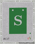 A taped needlepoint canvas with the design: Banner 18 mesh count Squared S White on Green.