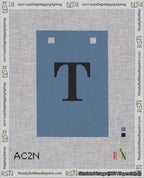 A taped needlepoint canvas with the design: Banner 18 mesh count Squared T Black on Blue.