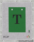 A taped needlepoint canvas with the design: Banner 18 mesh count Squared T Black on Green.
