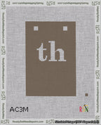 A taped needlepoint canvas with the design: Banner 18 mesh count Squared th White on Brown.