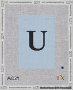 A taped needlepoint canvas with the design: Banner 18 mesh count Squared U Black on Light Blue.