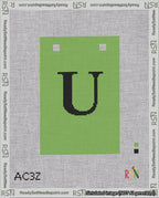 A taped needlepoint canvas with the design: Banner 18 mesh count Squared U Black on Light Green.