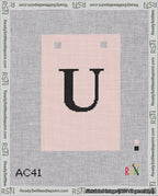 A taped needlepoint canvas with the design: Banner 18 mesh count Squared U Black on Pink.