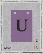 A taped needlepoint canvas with the design: Banner 18 mesh count Squared U Black on Purple.