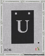 A taped needlepoint canvas with the design: Banner 18 mesh count Squared U White on Black.