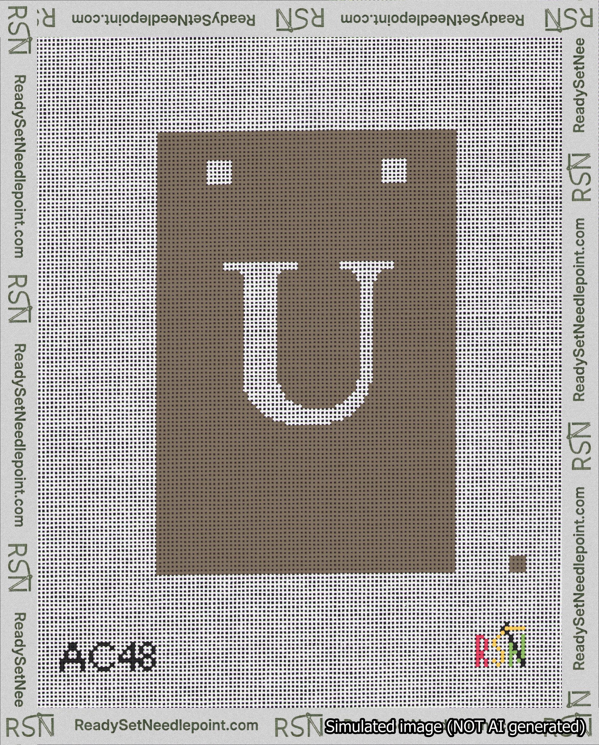 A taped needlepoint canvas with the design: Banner 18 mesh count Squared U White on Brown.